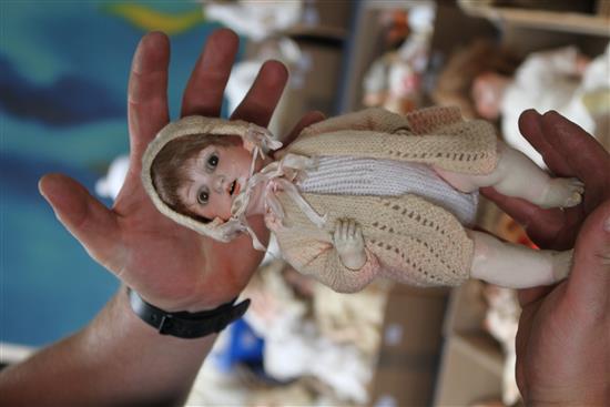 An AM baby , bent limb body, 10in. and a Google Artist doll, 11in. (2)